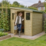 Woman with a watering can at the open door of the Elmstead pent shed