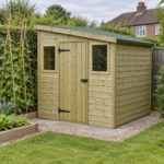 Elmstead 7x7 pressure-treated pent shed in the corner of a vegetable garden