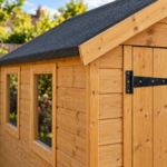 Close-up of the shiplap cladding, T-hinge and roof edge of the Hartwell shed