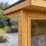 Close-up of the shiplap cladding and glazing frame of the Thornbury summerhouse